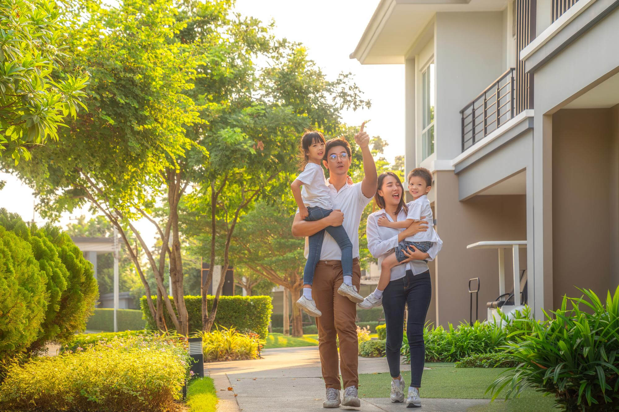 A family enjoying a green residential neighbourhood